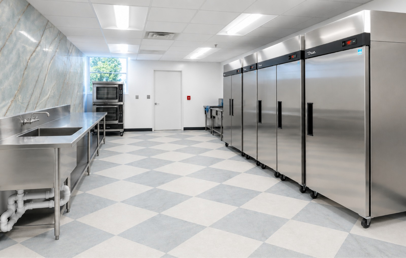 The brand-new kitchen at The Gan, with stainless steel counters and refrigerators